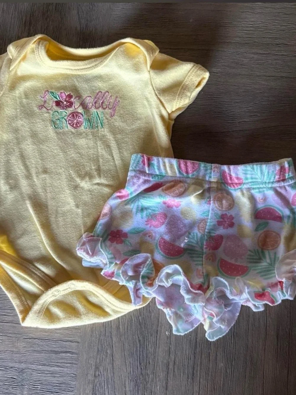 Yellow 'Locally Grown' Baby Onesie & Pastel Fruit Ruffle Shorts Set